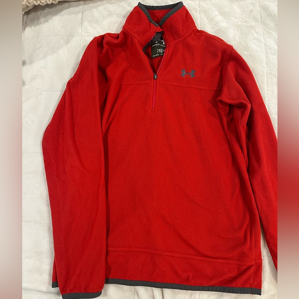 Red Women’s Under Armour microfleece quarter-zip. Grey trim, embroidered logo.